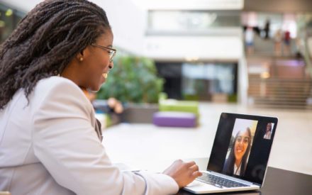 two female professionals on video conference