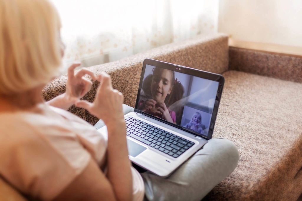 woman on video conference with child