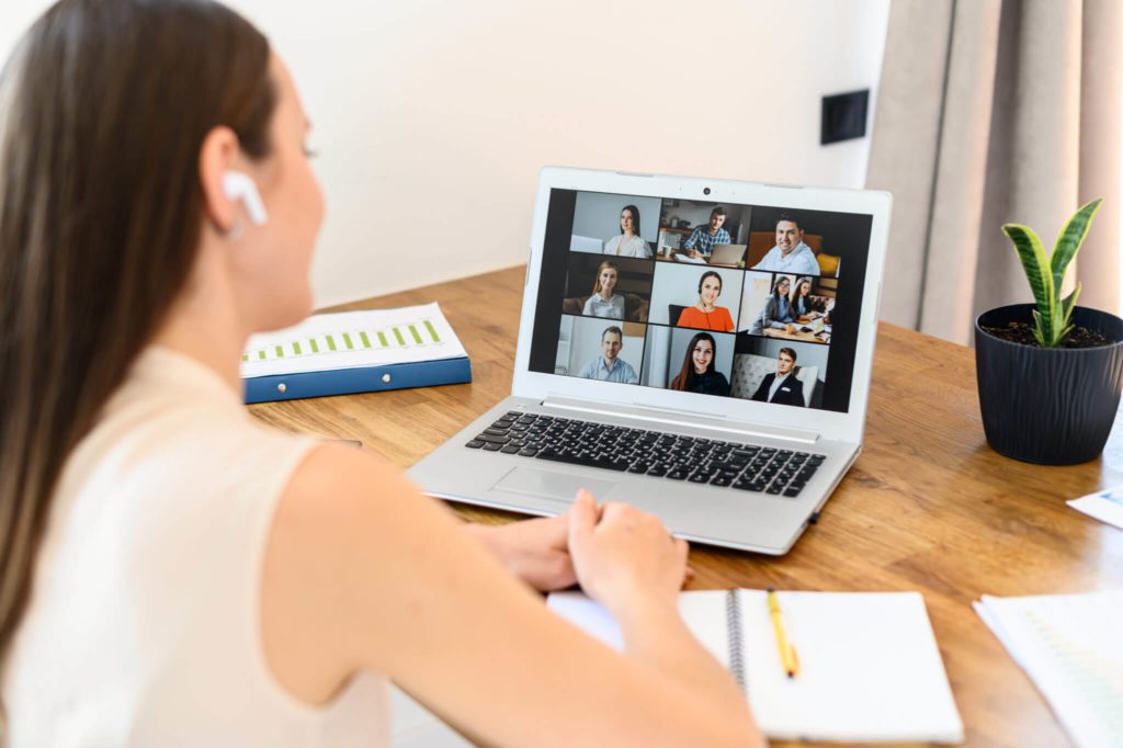 young professional female on video conference in front of computer
